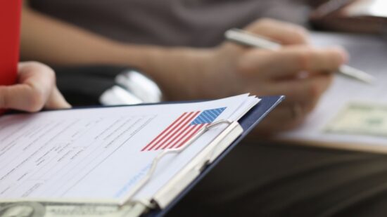 passport details application form. Briefing before an interview at US Embassy. Payment consular fee-Shutterstock_1693797880